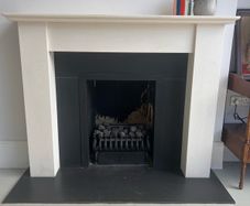 Modern style limestone fireplace and gas fire basket