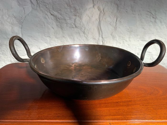 Large heavy antique copper dish with ring handles.