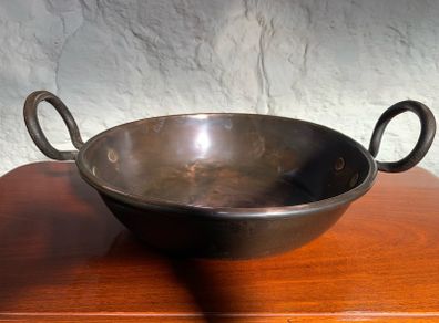 Large heavy antique copper dish with ring handles.