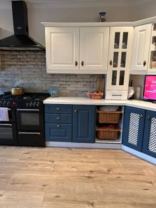 18 kitchen presses , worktop, white sink.