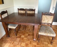 Antique extendable oak table and 4 carved oak chairs