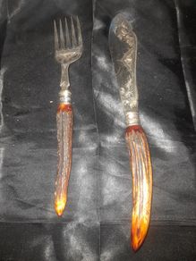 A Pair of Antique Victorian Era Fish Servers with Antler Handles and Engraved Silver Plated Blades, Commonly made in Sheffield in the late 19th Century