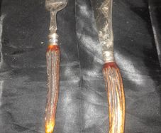 A Pair of Antique Victorian Era Fish Servers with Antler Handles and Engraved Silver Plated Blades, Commonly made in Sheffield in the late 19th Century