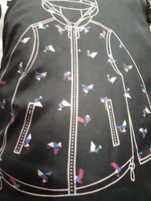 New rain coat with tag attached