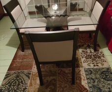 Walnut base and matching 4 chairs. Bevelled edge glass top