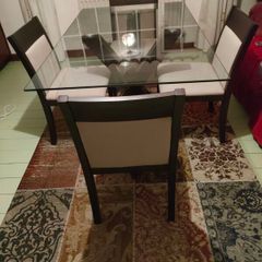 Walnut base and matching 4 chairs. Bevelled edge glass top