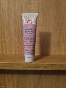 First Aid Beauty KP Bump Eraser Body Scrub with 10% AHA, which is a targeted body treatment formulated to address Keratosis Pilaris (KP)