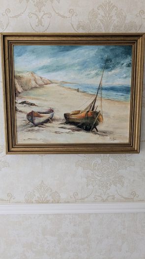 Framed coastal oil painting - boats on beach