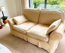 Two 2-seater linen sofas