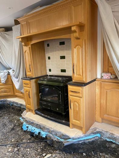Oil stove with Oak Mantle surround