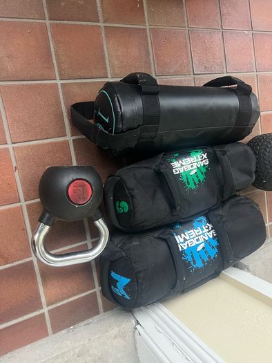 Sandbags, kettlebell, medicine ball
