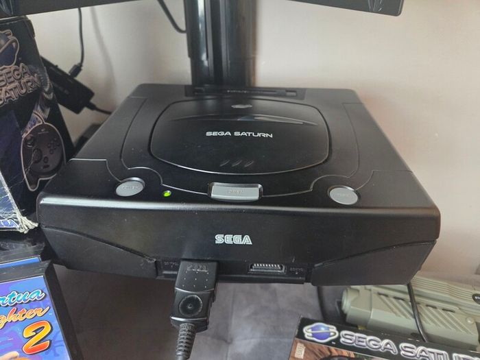 Sega Saturn w/ 3D Control Pad, Arcade Racer, Lightgun and Games