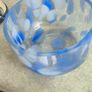 A hand-blown blue and white swirl art glass piece Small glass bowl with sticker say The phrase "EVERY PIECE IS UNIQUE" circles the clover. Image 5