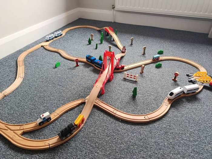 Wooden train set with 5 vehicles and turnstile