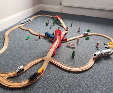 Wooden train set with 5 vehicles and turnstile