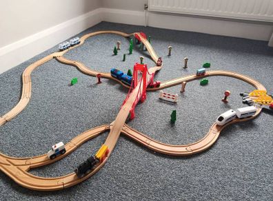 Wooden train set with 5 vehicles and turnstile
