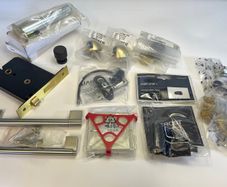 A selection of Door stoppers, Door Lock, Window restrictor and other items.
