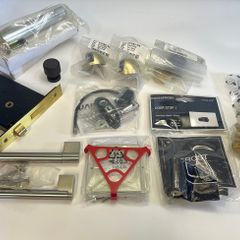 A selection of Door stoppers, Door Lock, Window restrictor and other items.