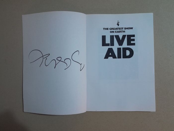 Live Aid book signed by Bob Geldof with proof