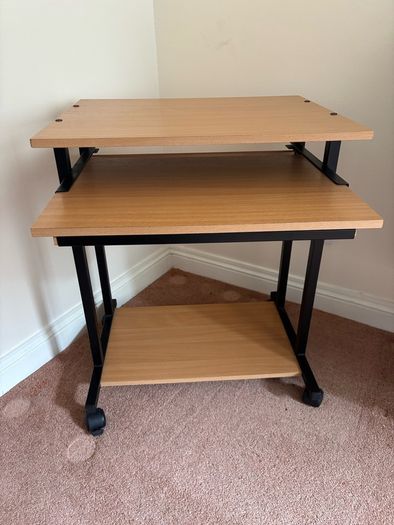 Computer desk with sliding shelf on wheels