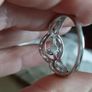 A 925 sterling silver ring with a floating diamond centerpiece. Image 3