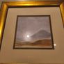 Gold framed picruer of land scape. Image 2