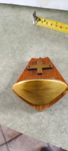 Religious wooden Holy water font stoup with cross crucifix.