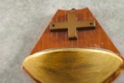 Religious wooden Holy water font stoup with cross crucifix.