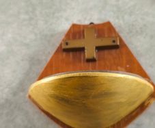 Religious wooden Holy water font stoup with cross crucifix.