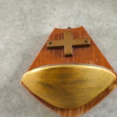 Religious wooden Holy water font stoup with cross crucifix.