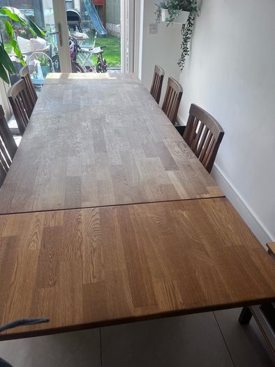 Solid oak dining table and chairs