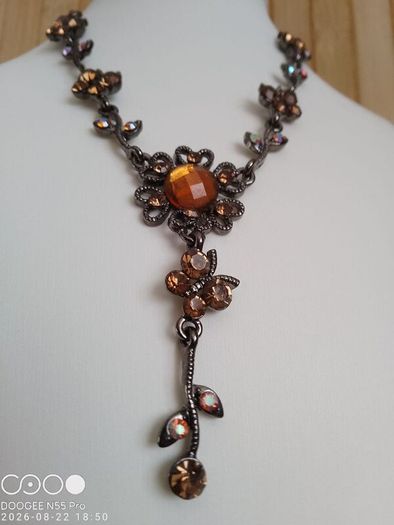 Victorian revival aesthetic  dark antiqued metal with warm amber tones