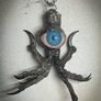 Protective Raven Claws Soldered with a Prosthetic Blue Eye Talisman Image 2