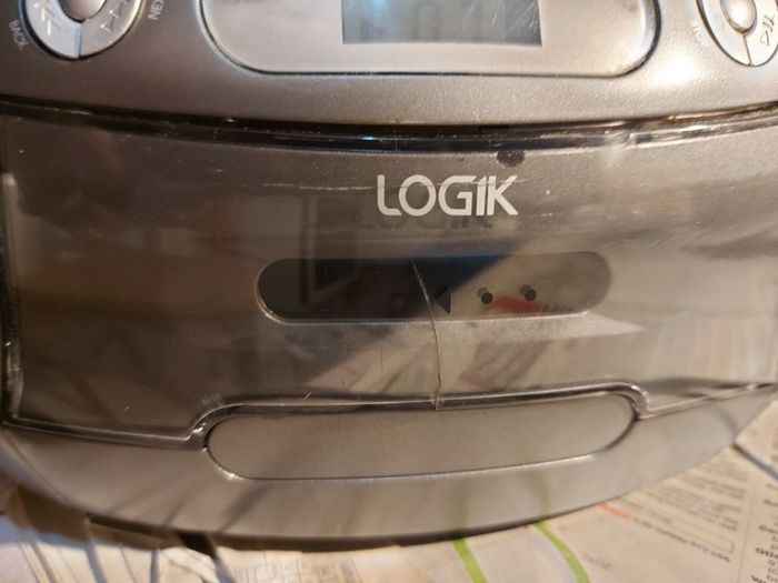 Logik CD Stereo With Cassette, Model LCCSTR10, in good condition, Radio and CD work fine, Tape play button not staying engaged, Forward and rewind work