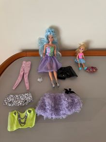 1 Barbie doll with clothes accessories and 1 smaller doll