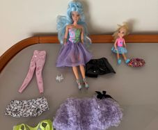 1 Barbie doll with clothes accessories and 1 smaller doll