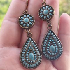 Vintage-style long bohemian drop earrings featuring turquoise enamel and a bronze-tone metal finish.