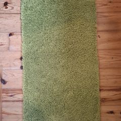 2 green rugs