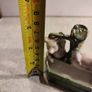 figurine of two pigs cooling down at bone china  water pump. Image 3