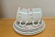 Two cups, saucers and plates