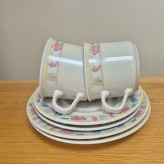 Two cups, saucers and plates