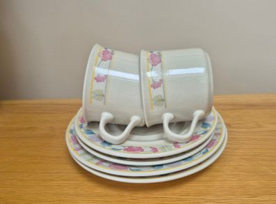 Two cups, saucers and plates