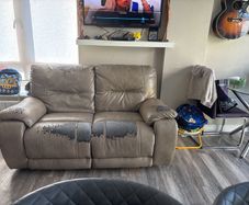 Grey 2 seater faux leather couch with recline