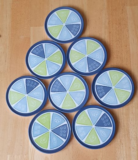 New - A Set of 8 Coasters - E