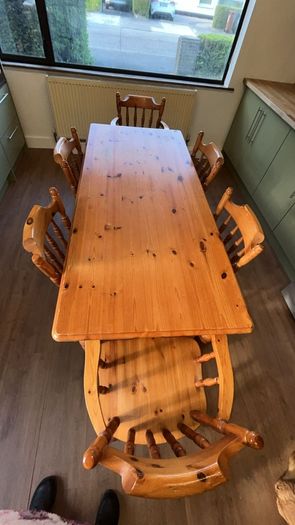 Soid Pine kitchen table and 6 chairs, 2 are 'Carvers' (with arms) and 4 are standard.
