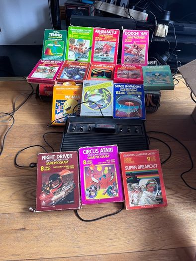 Atari 2600 Space Invaders Woody Atari 2600 with 15 individual games and 14 game Indy 500 driving