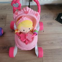 Baby walker with doll