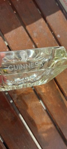 Guinness vintage heavy pressed glass ashtray,,,collectors item, unusual with clear glass ,guinness logo on the 4 sides ,,see pictures for condition, sold as seen ,