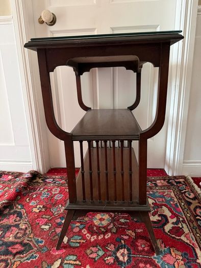 Mahogany table with glass top.
