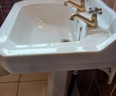 Bathroom sink, bath and bidet.